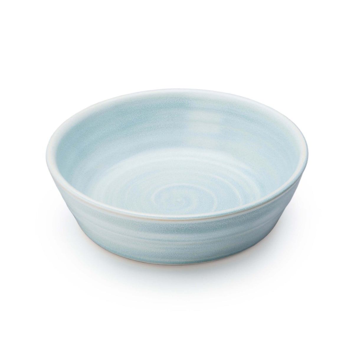 Light blue ceramic bowl with concentric circle pattern and matte finish.