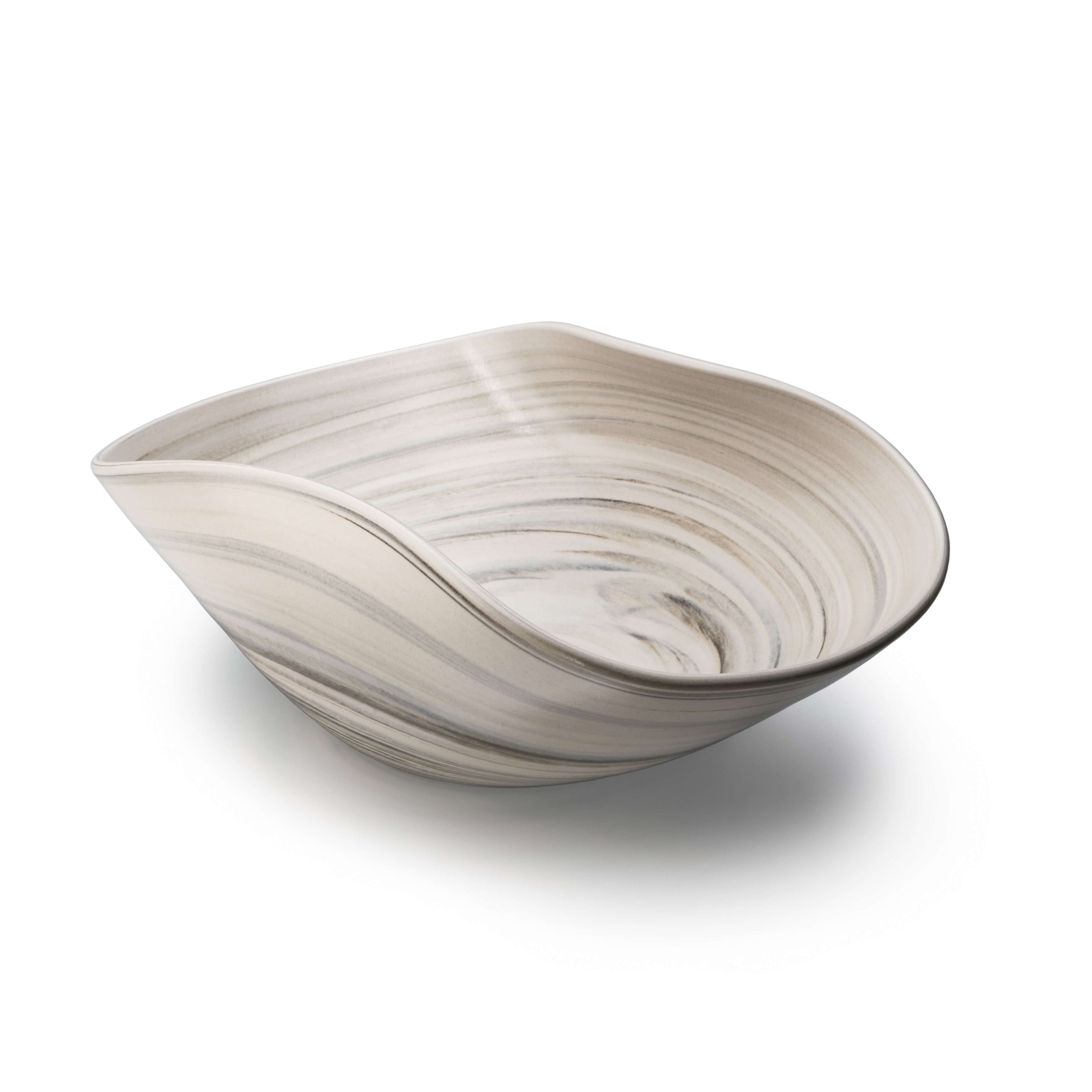 Sand-colored serving bowl with organic curved shape and swirled surface texture.