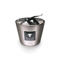 Platinum-colored cylindrical candle with black label, lid, and black ribbon bow from Baobab Collection.