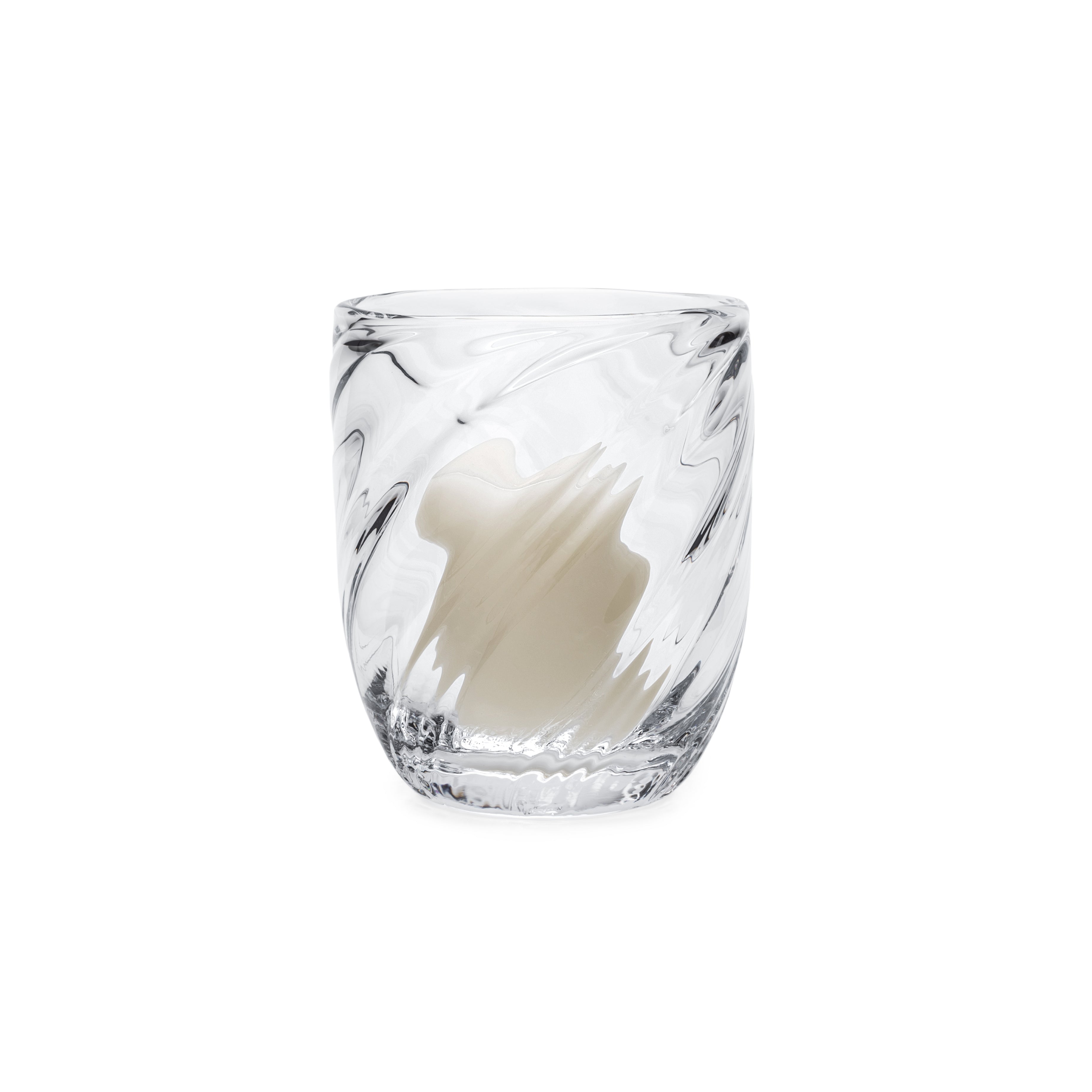 Clear glass candle holder with black swirl pattern and cream-colored wax candle inside.