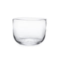 Clear glass bowl with wide rounded sides and flat bottom.