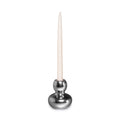 Silver aluminum candlestick with spherical base and tapered cream candle inserted in socket.