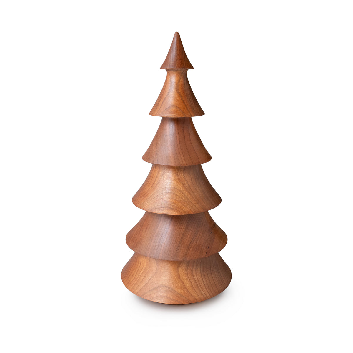 Cherry wood evergreen tree sculpture with tiered conical sections and pointed top.
