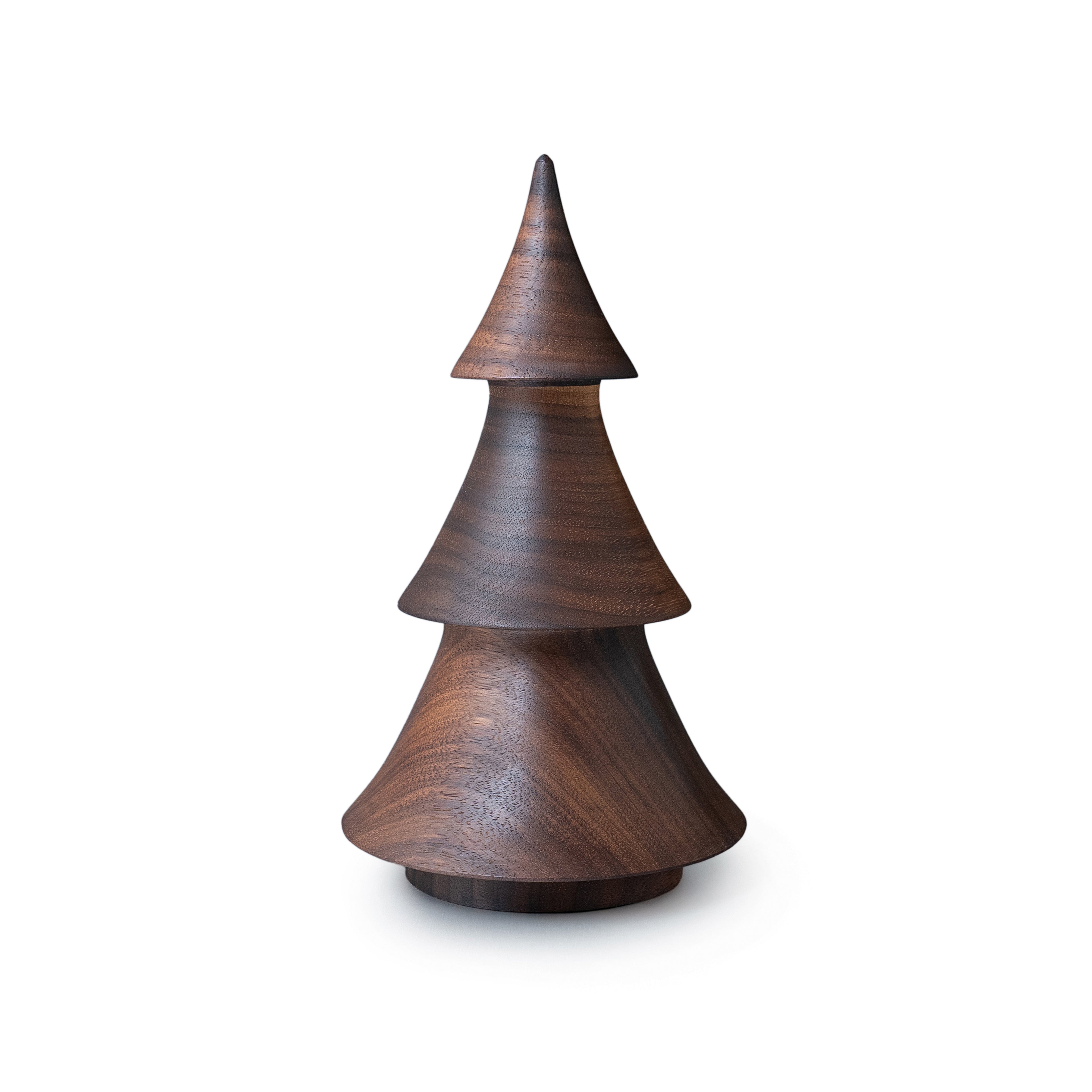 Dark walnut wood evergreen-shaped decorative object with tiered cone sections and pointed top.
