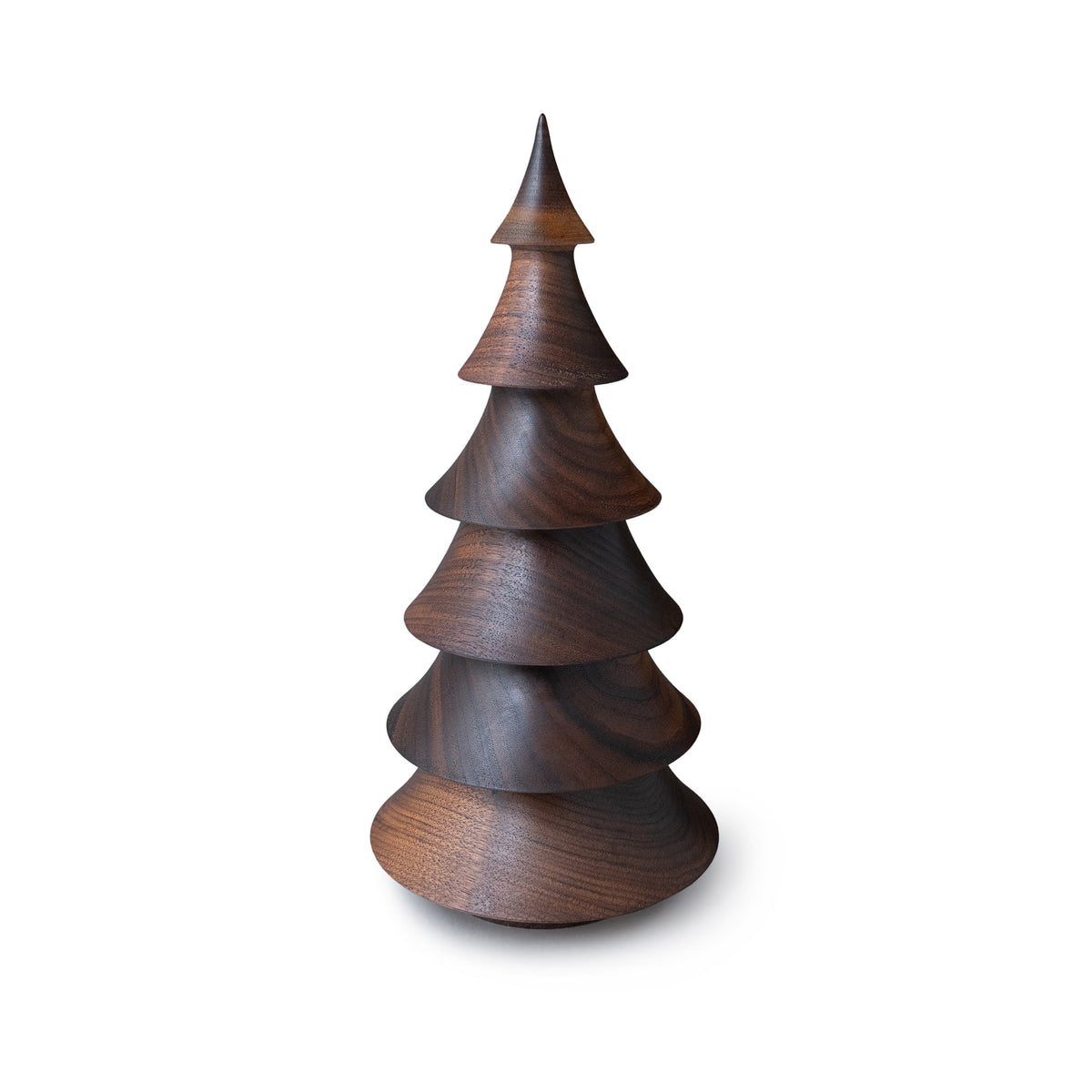 Turned walnut wood evergreen tree sculpture with stacked conical sections and pointed top.