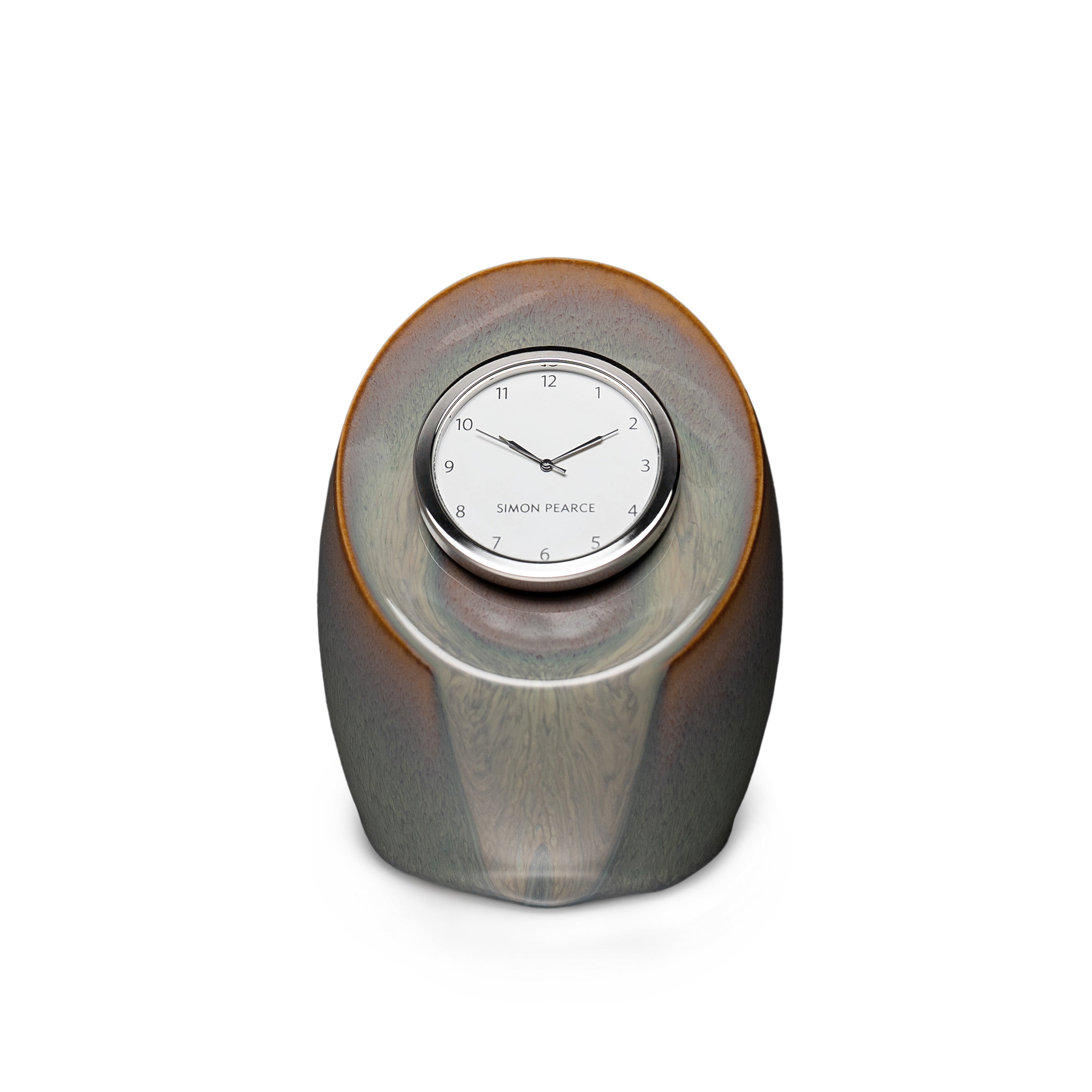Gray pottery clock with rounded oval shape and embedded circular clock face with numerals and Simon Pearce branding.