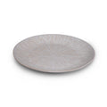White ceramic platter with radial line pattern radiating from center, shallow dish shape.