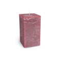 Deep berry-colored square pillar candle with white wick and textured wax surface.