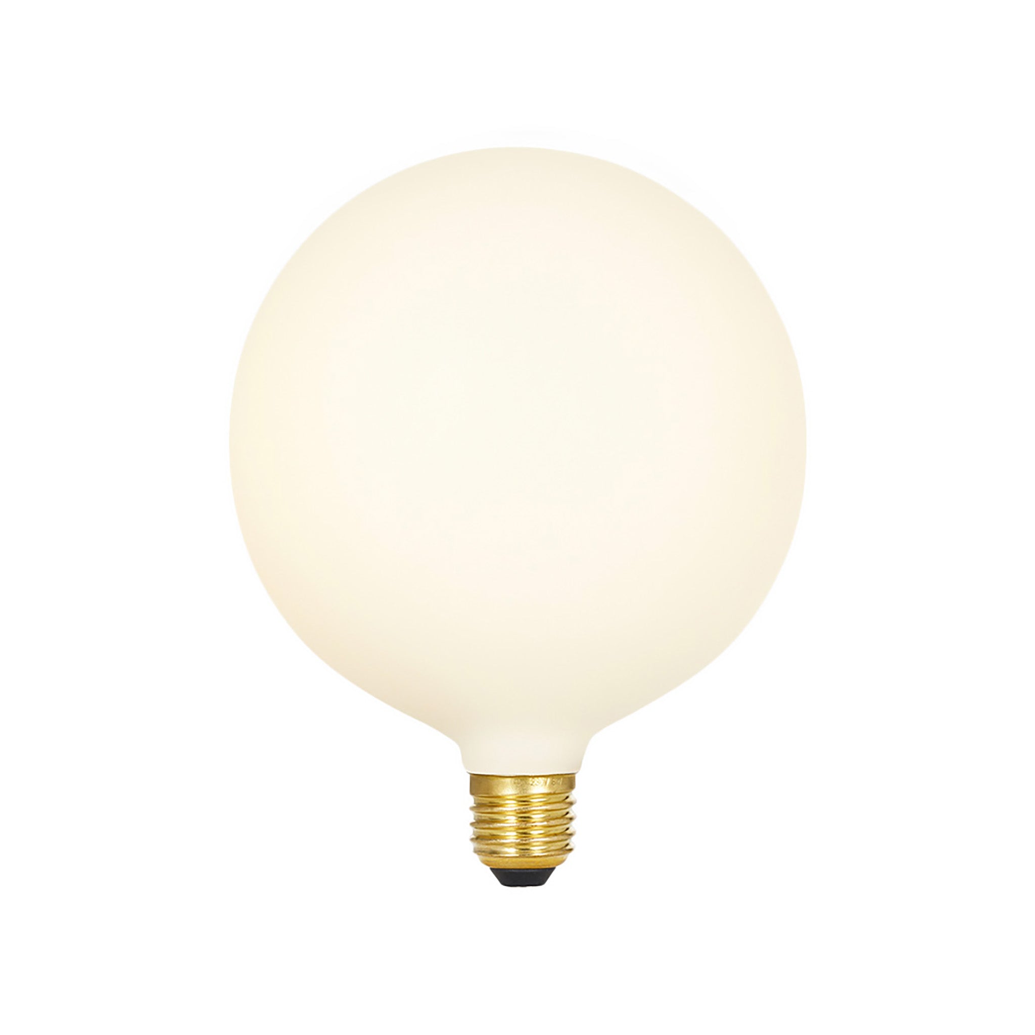 Spherical matte cream porcelain LED bulb with brass base and black contact point.