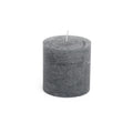 Grey cylindrical pillar candle with white wick, textured finish surface.