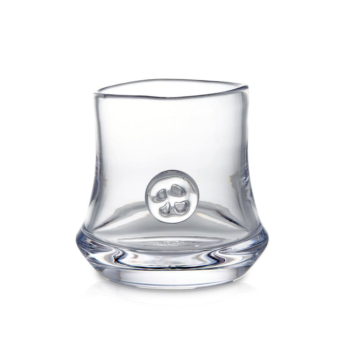 Clear glass tumbler with curved sides and circular emblem on front.