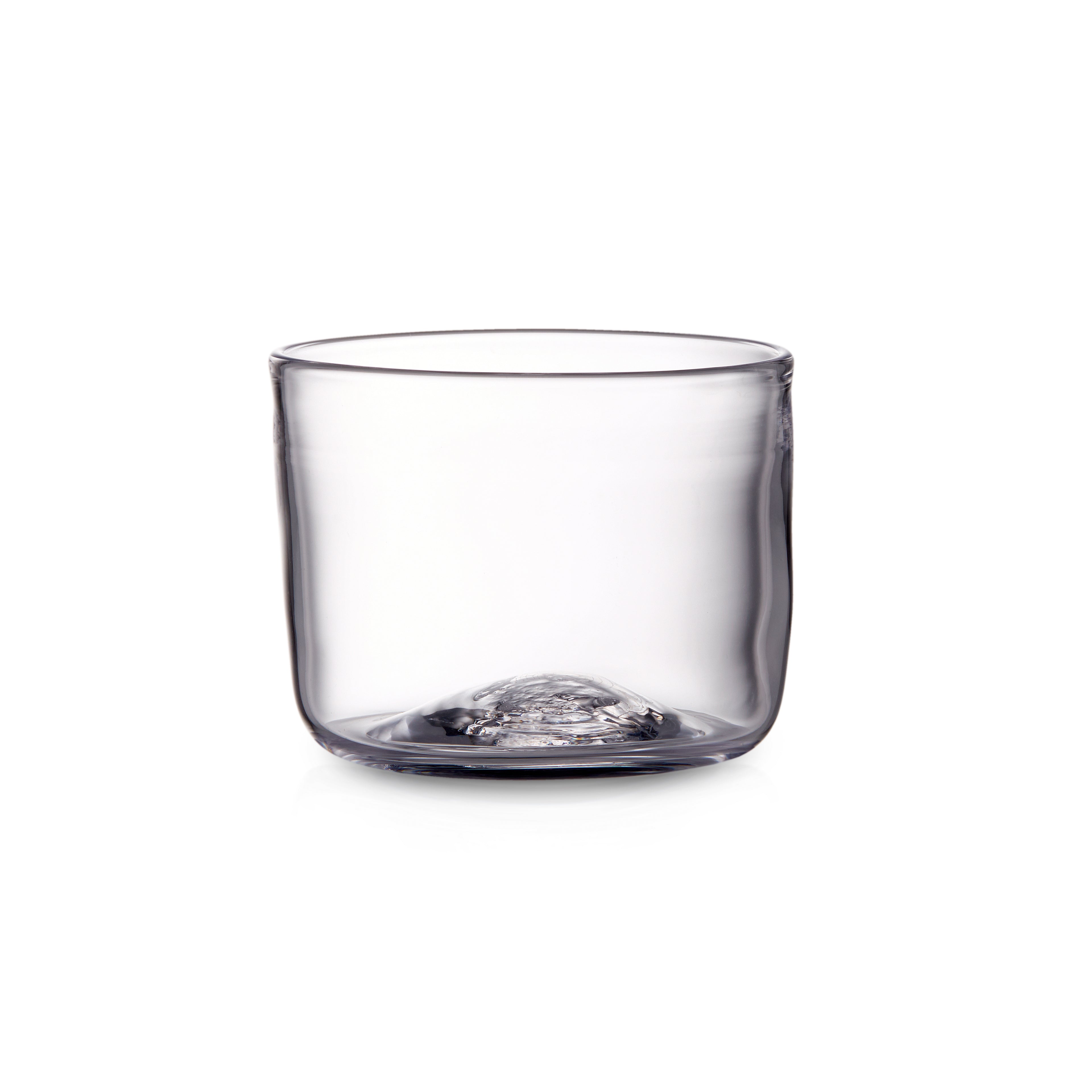 Clear cylindrical glass with rounded bottom and smooth rim, shown empty against white background.