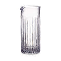 Clear glass bar pitcher with vertical ribbed pattern and pouring spout.