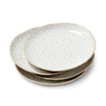 Four stacked white and gray appetizer plates with textured cloud-like surface and natural edge trim.