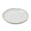 White ceramic appetizer plate with cloud-like pattern and natural edge rim.