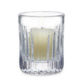 Clear crystal hurricane candle holder with vertical ribbed pattern and cream-colored pillar candle inside.