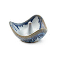 Curved ceramic ring holder with blue and white glaze, featuring a central cone post.