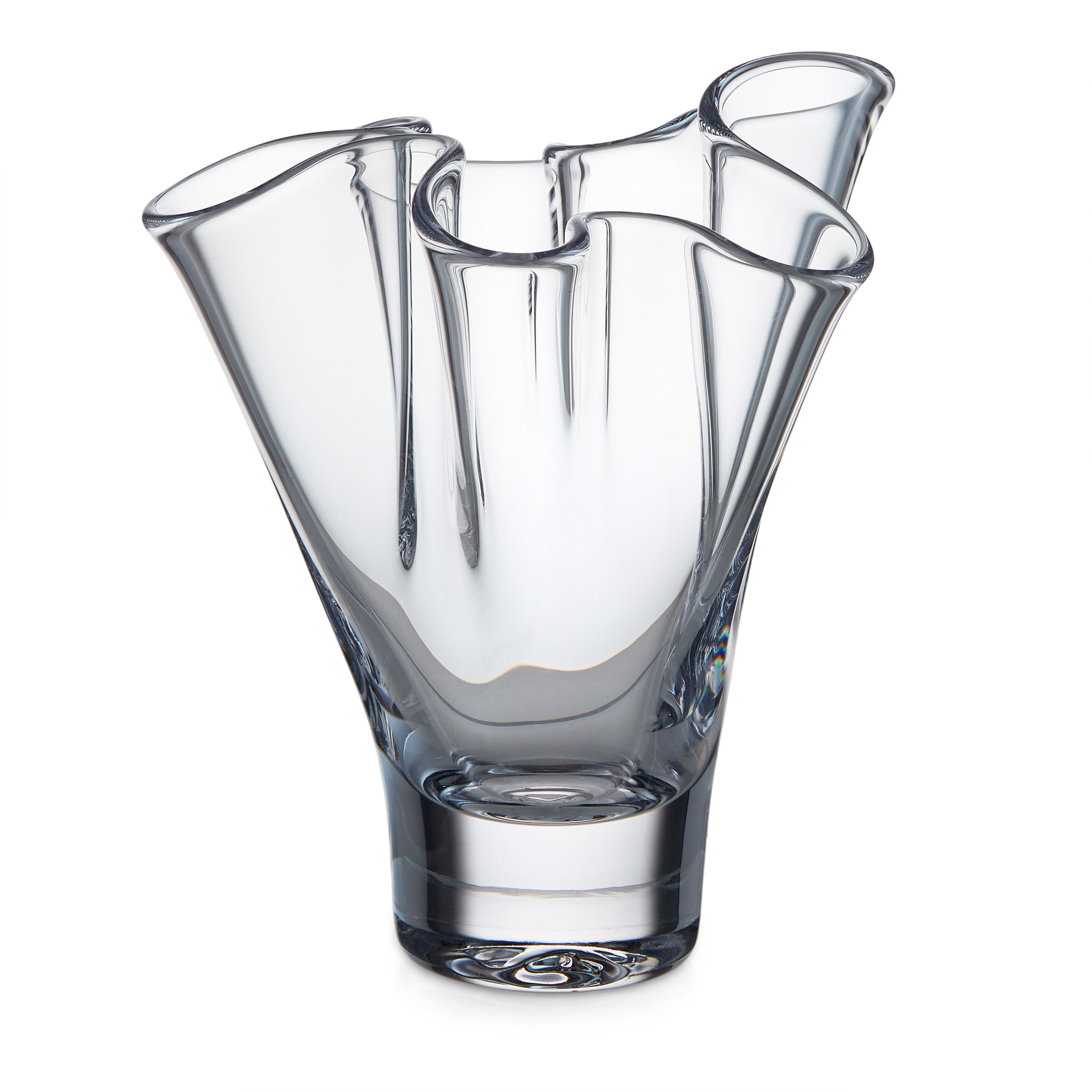 Clear glass vase with wavy ruffled rim and fluted petal-like sides.