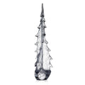 Tall glass evergreen tree sculpture with twisted bubble design and pointed top in gray and white tones.