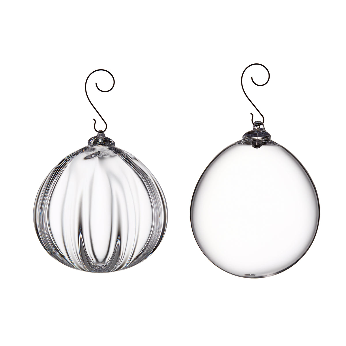 Two clear glass round ornaments with metal hooks: one with vertical ribbed texture, one smooth.