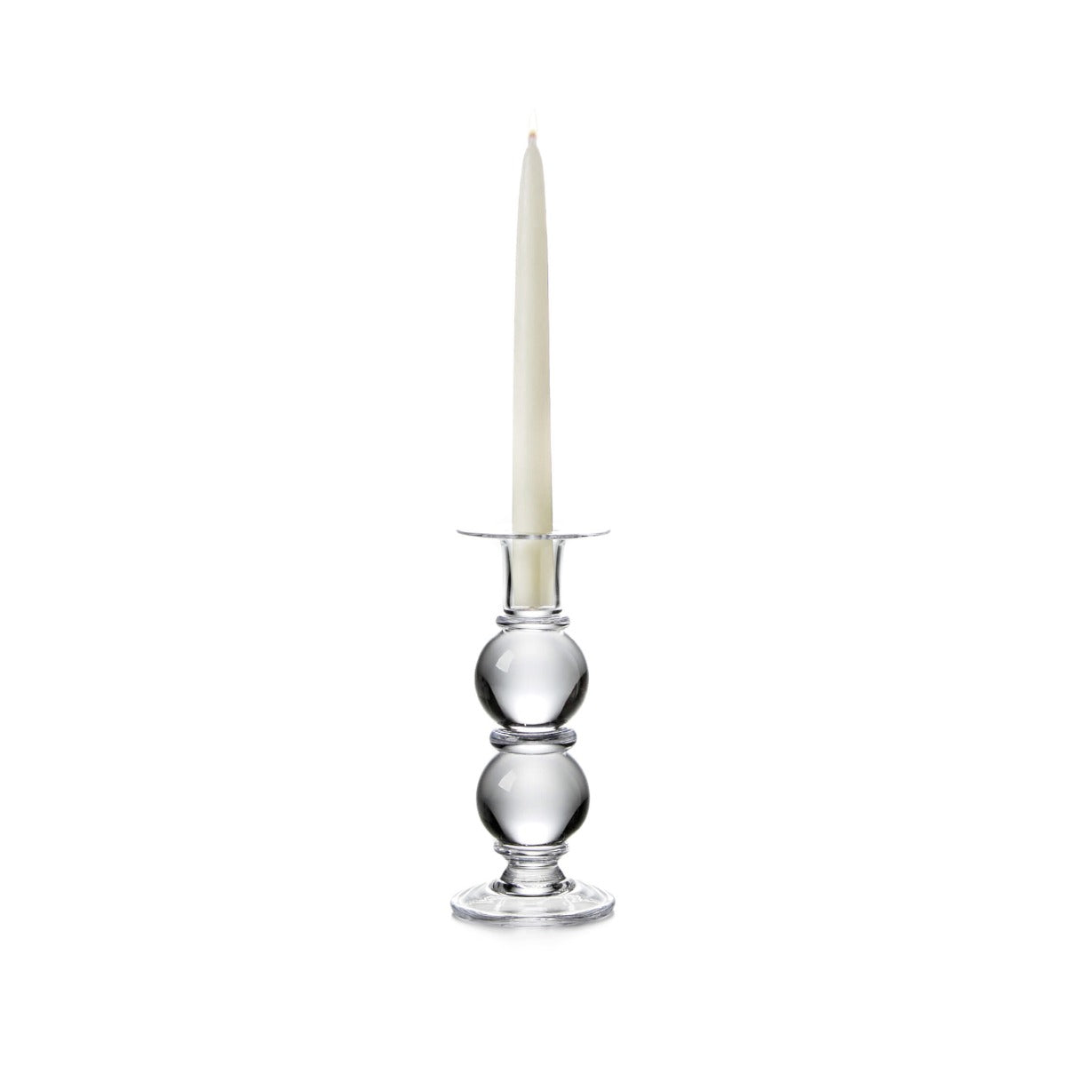 Clear glass candlestick with stacked spherical base holding a cream-colored taper candle.