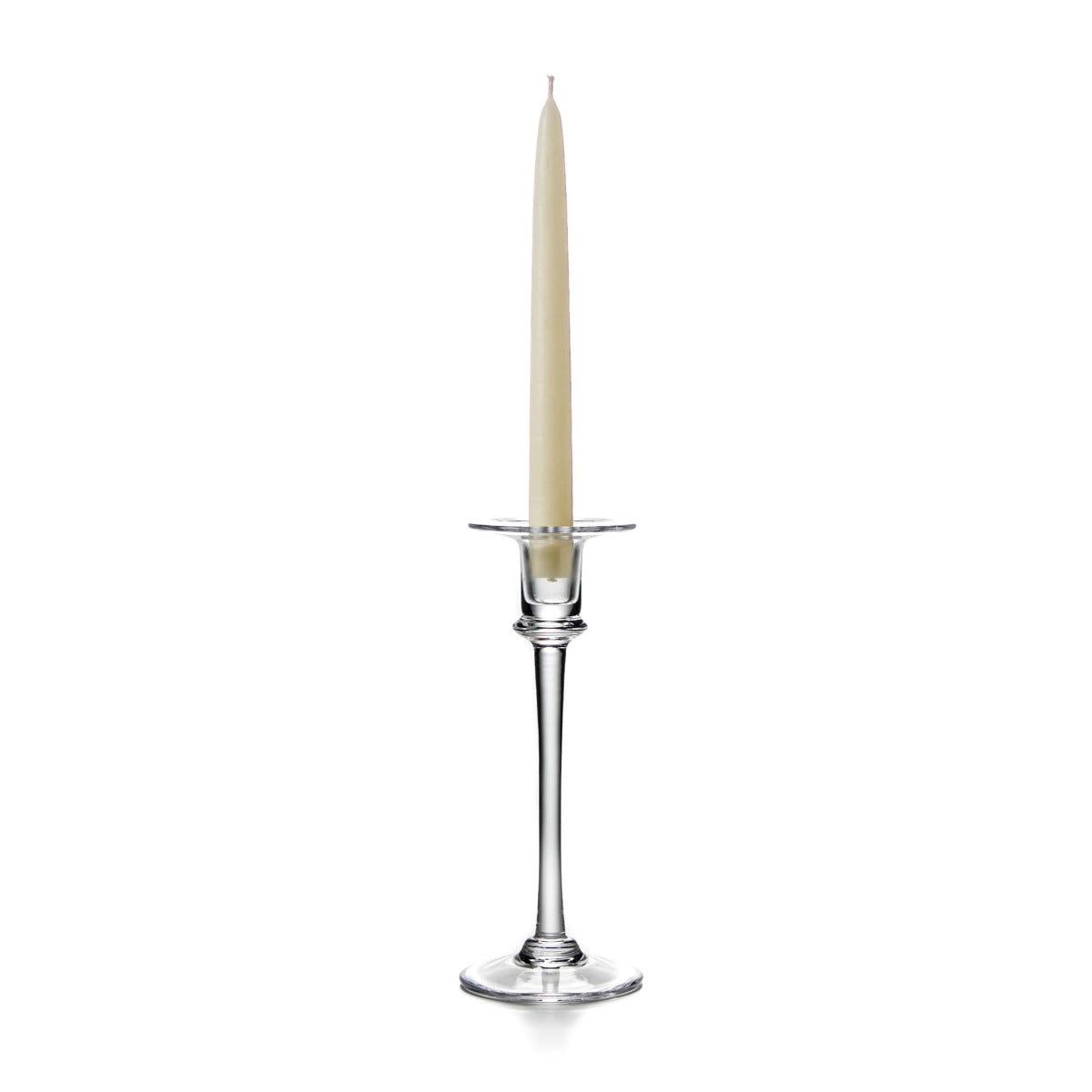 Tall clear glass candlestick with cream taper candle and wide drip ring base.