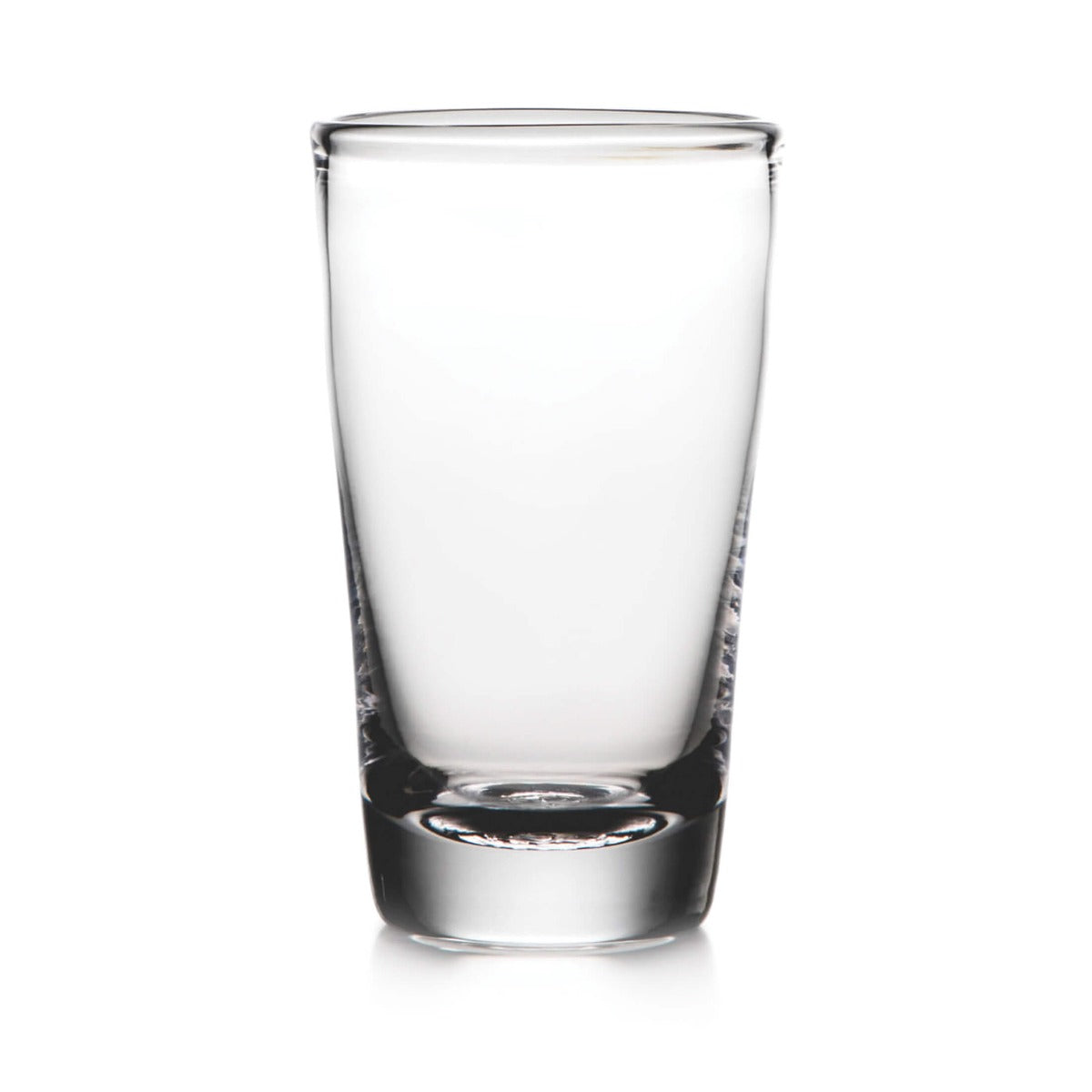 Clear glass pint glass with thick base and tapered cylindrical shape.