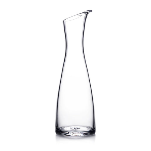 Clear glass carafe with curved sides and a pouring spout at the top.