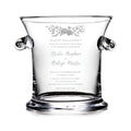 Clear glass ice bucket with engraved wedding invitation text and floral design, featuring two black handles.