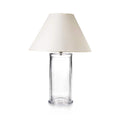 Clear glass cylindrical lamp base with cream-colored fabric shade.