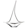 White sailboat figurine with tall mast, curved sail, and black accent line on hull.