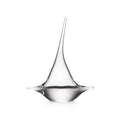 Clear glass sailboat-shaped decorative object with pointed top and wide base on white background.