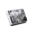 Horizontal acrylic photo block displaying black and white cityscape photograph with architectural buildings.