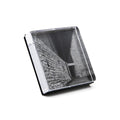 Clear acrylic photo block with black and white architectural image inside white gift box packaging.
