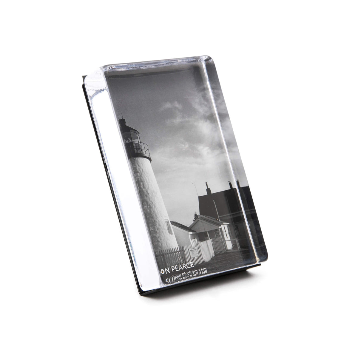 Vertical acrylic photo block displaying black and white lighthouse with attached building image.