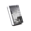 Vertical photo block with black and white lighthouse image, clear acrylic front, and black stand base.