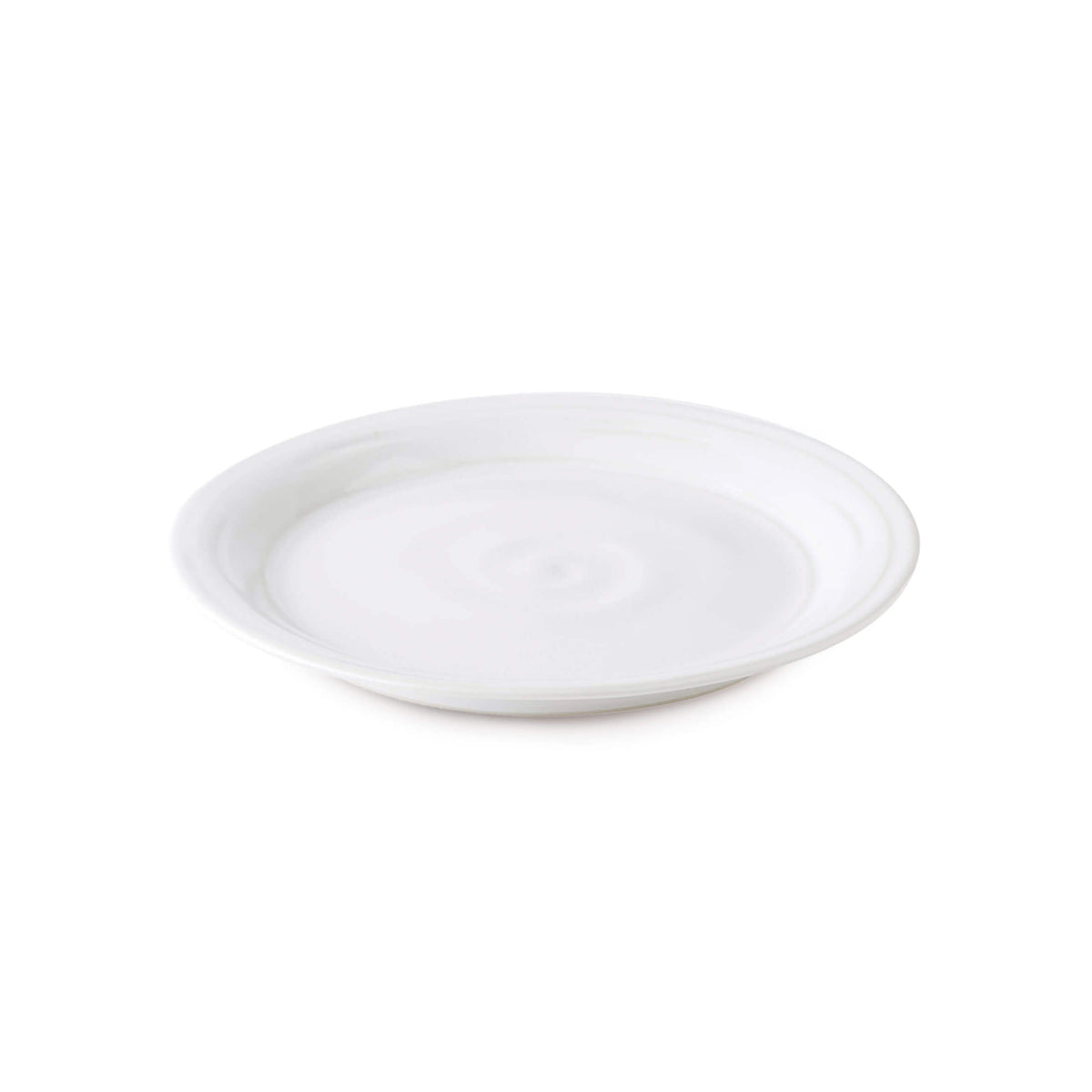 Dove gray ceramic side plate with shallow well and rounded rim.
