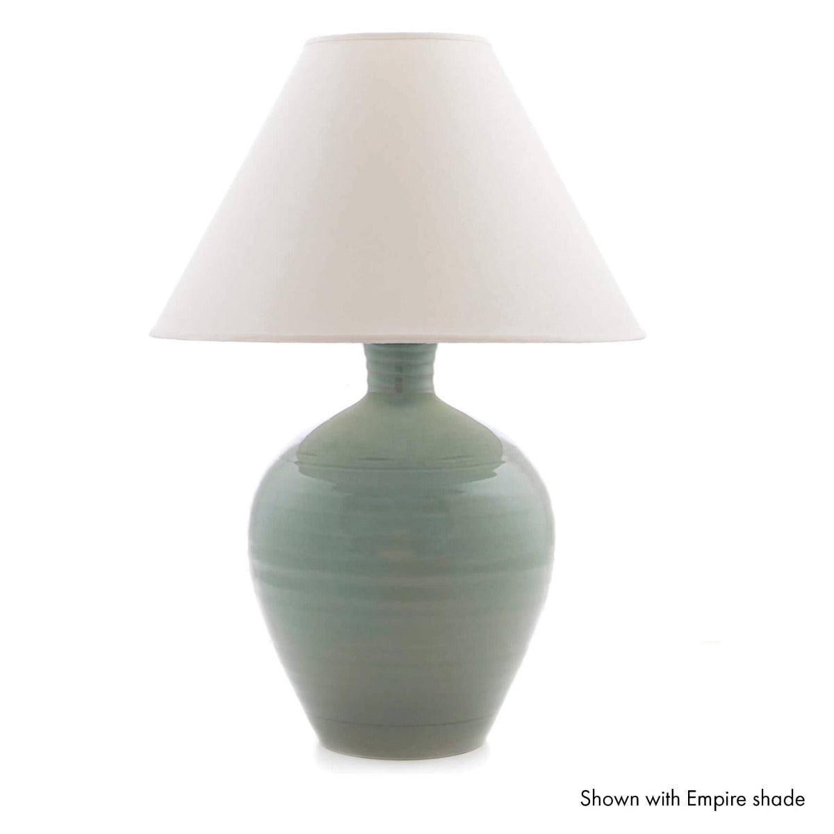 Sage green pottery lamp base with cream linen empire shade.