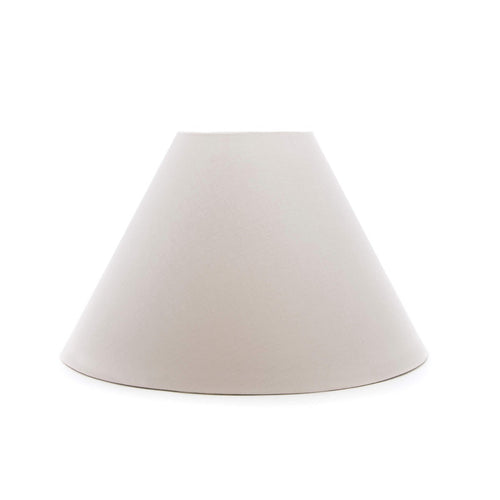 Cream-colored linen empire lamp shade with tapered cone silhouette.