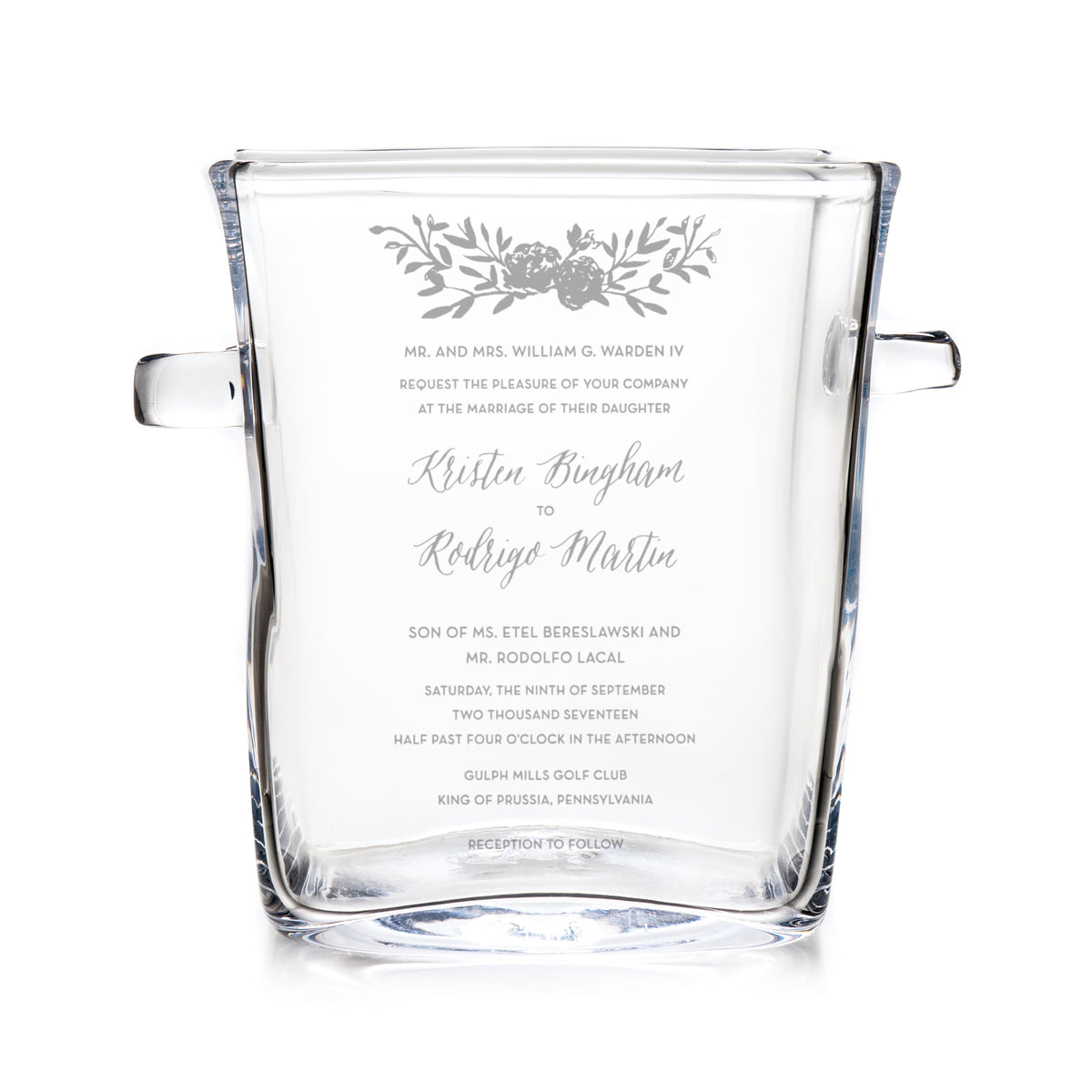 Clear glass chiller with engraved wedding invitation text and floral design, featuring handles on sides.