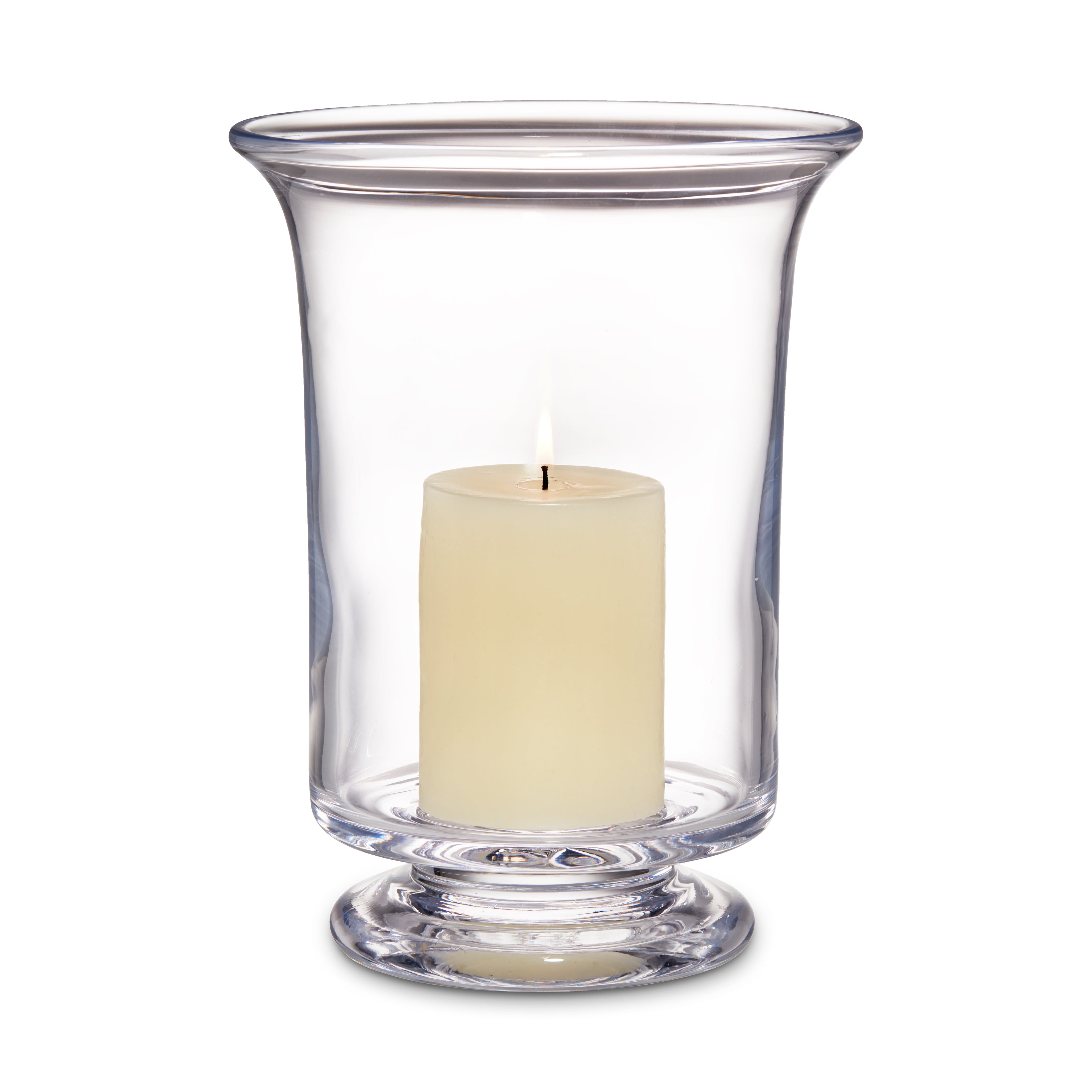 Clear glass hurricane vase with cream-colored pillar candle inside and pedestal base.
