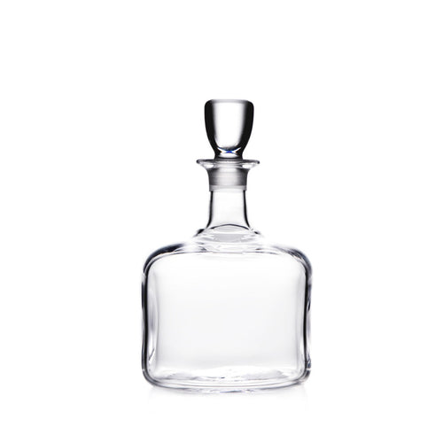 Clear glass decanter with a narrow neck, wide rounded body, and a rounded glass stopper.