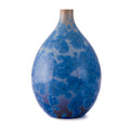 Cobalt blue teardrop vase with crystalline pattern and tapered neck, transitioning from dark blue at base to lighter tones.