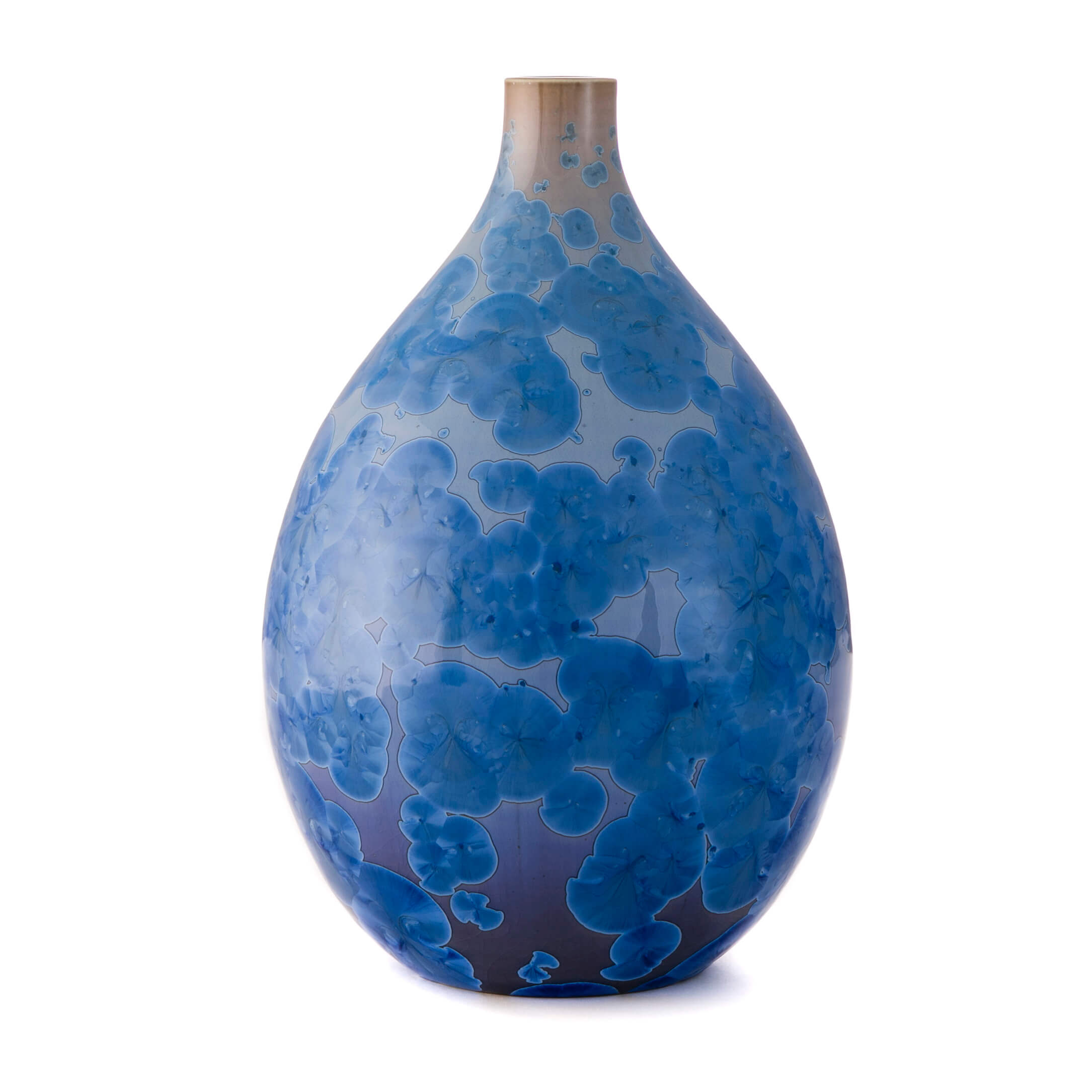 Cobalt blue teardrop vase with crystalline pattern and tapered neck, transitioning from dark blue at base to lighter tones.