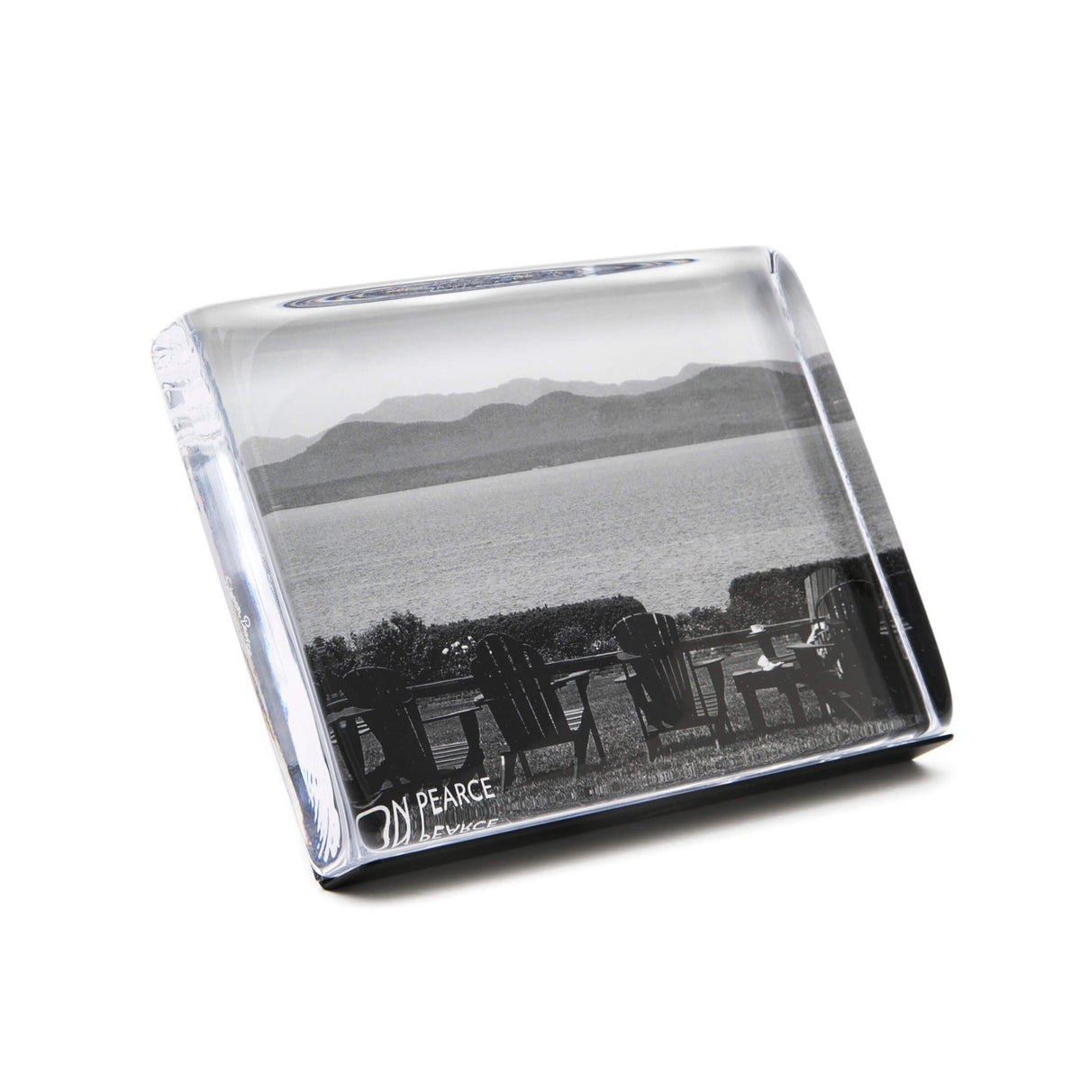 Clear acrylic photo block displaying black and white landscape image with chairs, water, and mountains.