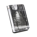 Clear acrylic photo block with black and white canal street scene featuring ornate railing, displayed at an angle.