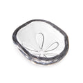 White ceramic bowl with sand dollar pattern and dark gray rim, shown from above.