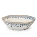 White ceramic bowl with blue brushstroke details along the rim and interior edges.
