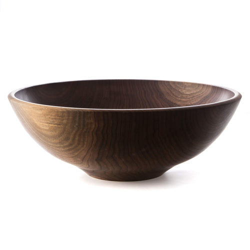 Black walnut wooden bowl with a dark finish and visible wood grain rings throughout the interior and exterior.