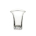 Clear glass tumbler with flared rim and curved sides tapering toward a squared base.